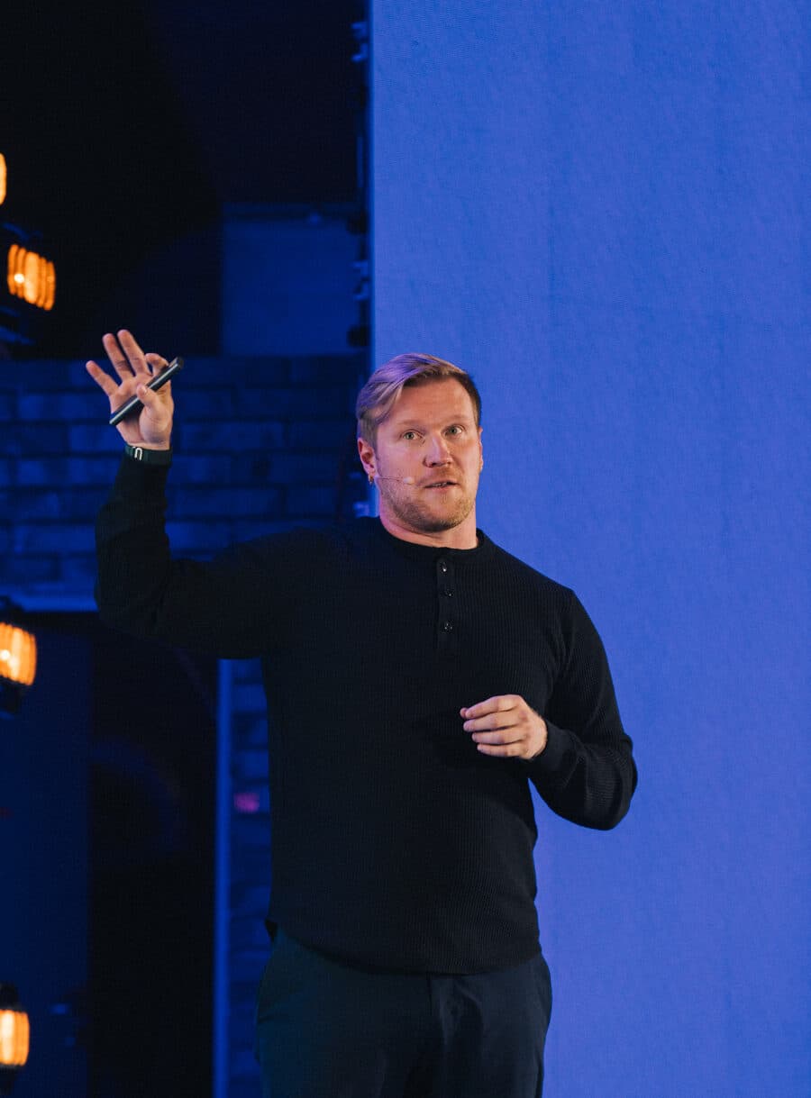 Perttu presenting against a blue backdrop at App.js Conf